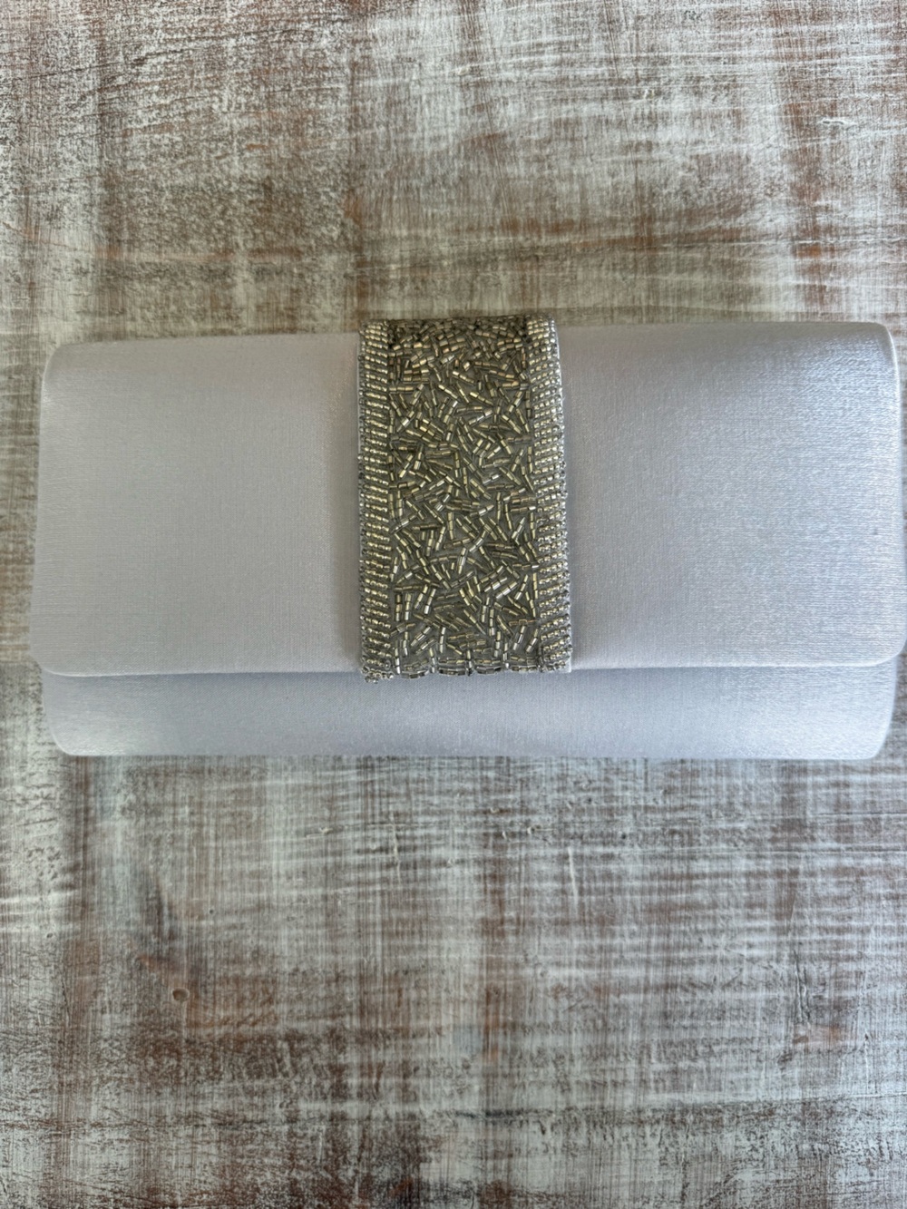 Elegant Silver Evening Clutch with Beaded Accent and Woven Strap